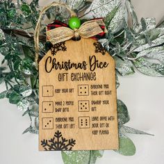 a wooden christmas gift exchange hanging from a tree