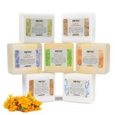 five soaps with different types of flowers next to them