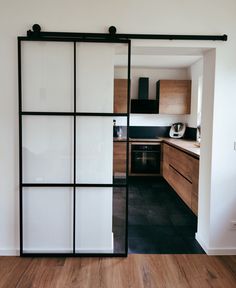 an open sliding glass door in a kitchen