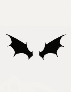 two black bats are facing each other in the same direction on a white background,