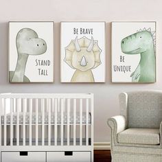 a baby's room with three dinosaur prints on the wall