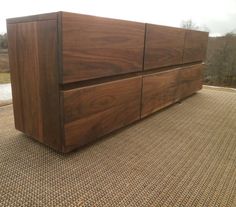 a large wooden dresser sitting on top of a carpet