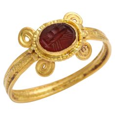 We are proud to show this circular hoop of 22 Kt gold, with coiling around the shoulders, sets an oval shaped intaglio"dextrarum lunctio" on the carnelian. This translates to clasped hands. Each hand is holding the other's right hand. Jewelry history and fine art represent this image as a union of two people in marriage. Could a wedding band be more meaningful? This jewel may be that of a Roman wedding ring from the first 100 years AD to the century 300 AD. The ring is in superb condition and we Roman Wedding, Etruscan Jewelry, Clasped Hands, Ancient Roman Jewelry, Ancient Jewels, Medieval Rings, Roman Jewelry, Ring Jewellery Design, Ancient Jewellery