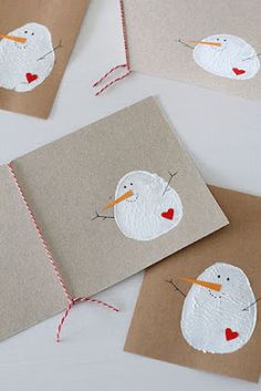 three cards with snowmen painted on them