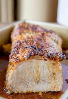 a piece of meat sitting on top of a wooden cutting board