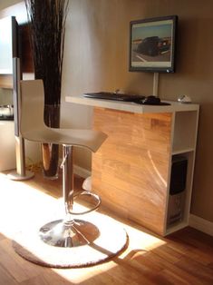 a modern bar stool in front of an entertainment center