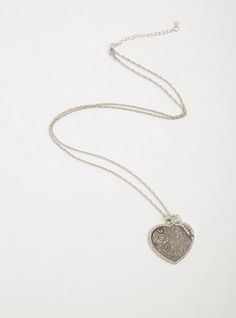 A large heart and key charm dangle off a long chain that amps up your look with its shimmering pave rhinestones and glitter underlay. Lobster clasp. 31. 75” length with 3. 5” extender. 1. 5”L x 1. 5”W pendant. Base metal. Imported. The best plus size women's silver-tone heart & key necklace necklaces in silver. Torrid is your destination for cozy fall and winter clothes to keep you warm and comfortable. Glamorous Silver Necklace For Valentine's Day, Glamorous Silver Heart Jewelry, Trendy Plus Size Fashion, Heart Key, Large Heart, Heart And Key, Special Occasion Outfits, Key Necklace, Long Chain