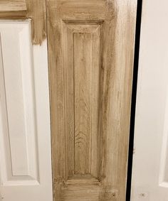 a close up of a wooden door with white paint on the front and side panels