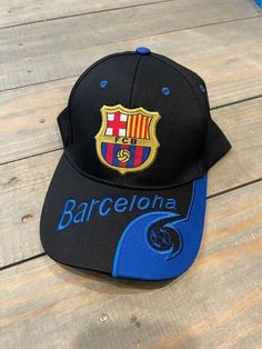 FCB Barcelona Embroidered Adjustable Adult Baseball Cap Hat. In great gently used condition. Snapback Sports Hat With Embroidery, Embroidered Snapback Sports Hat, Embroidered Snapback Hats For Sports, Fan Merchandise Hat With Embroidered Logo, Curved Visor Hat With Embroidered Logo For Fans, Fan Merchandise Visor Hat With Embroidered Logo, Sports Cap With Logo, Sports Cap With Logo For Sports Events, Fan Merchandise Cap With Embroidered Logo