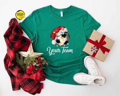 Christmas Soccer Shirt, Xmas Soccer Player T-shirt, Soccer Player Tee, Christmas Ball Shirt, Xmas Game Day T-shirt, Christmas Sport Shirt NOTE  We will use Black design for White, Athletic Heather and Heather Peach. White design for all other colors. Dear Customer, We're here to give you best Christmas shirt options for you. We want to make everyone smile with our cute , stylish and trendy graphic T-shirts. We can assured you this shirt will be perfect Christmas gift whether you will buy it yourself or for someone else. 1. Important Check size chart before you purchase 2. How to Order * Pick your shirt type and size Your design will be printed on the front.  *Pick your t-shirt color Add your design Name And Text Color 3.Production  Processing time is 1-3 business days. For rush orders plea Nfl Christmas, Cocoa Christmas, Balls Shirt, Christmas Tree Shirt, Sports Tee, Mama T Shirt, Christmas Gnomes, Merry Christmas Shirts, Basketball Mom