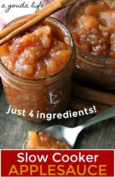 two jars filled with apples and cinnamon on top of a table