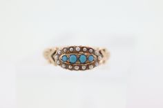 Beautiful Victorian Ring. Oval top with Turquoise and Pearl seed bezel set into a 10k Flower ornate shank.  Absolutely stunning. Condition: Shows some signs of use. Consistent with age. Made beginning of century. Details: 2.5mm turquoise 1.2mm pearl seeds Sz6.75 1.6grams Unmarked tests 10k Vintage Yellow Gold Turquoise Wedding Ring, Vintage Yellow Gold Turquoise Ring For Wedding, Antique Turquoise Round Ring For Wedding, Antique Turquoise Ring For Wedding, Antique Round Turquoise Wedding Ring, Antique Turquoise Cabochon Ring For Wedding, Antique Style Turquoise Wedding Ring With Cabochon, Victorian Turquoise Jewelry For Anniversary, Victorian Turquoise Jewelry For Wedding