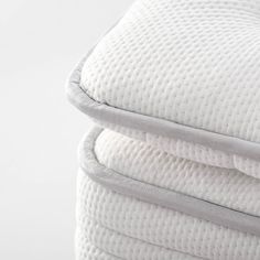 two pillows stacked on top of each other