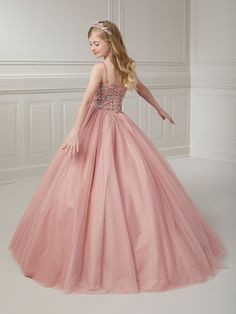 Your sweet girl will make a grand entrance in this bead embroidered long sleeveless illusion dress with A-line tulle skirt by Tiffany Princess 13723. This sleeveless gown features an illusion scoop neck sweetheart bodice with floral beaded embellishments, A-line sparkle tulle skirt, sweep train, and a lace-up back. House of Wu Tiffany Princess Collection Fall 2023 Style Number: 13723 Fabric: Floral Beading/Sparkle Tulle Please note: There may be a loss of glitter while wearing this dress due to Beaded Embellishments, Sleeveless Gown, Princess Collection, Illusion Dress, Grand Entrance, Fabric Floral, Fall 2023, Formal Gowns, Sweet Girls