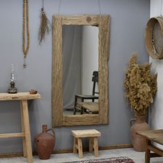 a room filled with wooden furniture and mirrors