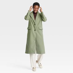 This Faux-Wool Pea Coat from A New Day™ offers a warm and classic look for brisk days. Made of midweight recycled polyester fabric with full lining, this faux-wool coat is designed with a notched collar, single-breasted front with buttons and long sleeves. It’s tailored in a casual, below-knee silhouette with a statement slit at the back, along with flap pockets on the front to complete the design with functional flair. A New Day™: Style that goes wherever you do. Maxi Sweater, Classic Trench Coat, Recycled Polyester Fabric, Wool Peacoat, Fall Coat, Travel Wardrobe, Double Breasted Coat, Long Sleeve Maxi, Pea Coat