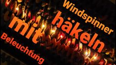 there are many lit candles in the shape of hearts and words that read, windspinner hakeln mitt beluchting