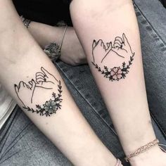 two people with matching tattoos on their arms