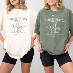 two women standing next to each other wearing t - shirts that say the threeties