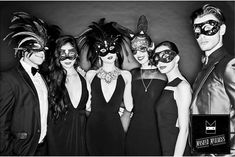 black and white photograph of people wearing masks