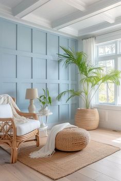 a living room with blue walls and wooden floors