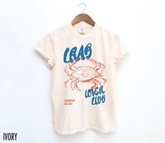 Show off your coastal cravings with this vintage-inspired tee! Featuring a retro crab graphic and the phrase "Crab Lover Club, Everyday All Day," this shirt is perfect for seafood enthusiasts who love a touch of retro flair. We use professional quality DGT printing on all our apparel. Direct-to-garment, or DTG, is a high quality printing method that sprays ink directly onto the garment so there is no peeling or cracking. This fabulous graphic will be printed on a Comfort Colors Unisex T-Shirt. P Seafood Extravaganza, Crab Shirt, Day Club, Retro Graphic Tees, Vintage Aesthetic, Summer Shirts, Crab, Comfort Colors, San Jose