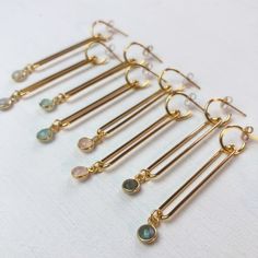 Long, elegant dangle earrings just in time for spring. These gorgeous earrings are made with an 18k gold-plated brass long loop on a small post hoop. A delicate gemstone bezeled in gold vermeil dangles at the bottom. Choose from eight colors. 18k gold-plated brass 2.25" length Available in green chalcedony, labradorite, rose quartz, pyrite, ruby, sapphire, black spinel, and moonstone Handmade in California Ships in 3-5 business days This item qualifies for free shipping Green Chalcedony, Gold Dangle Earrings, Ruby Sapphire, Black Spinel, Gold Earrings Dangle, Gorgeous Earrings, Gold Vermeil, Rose Quartz, Moonstone