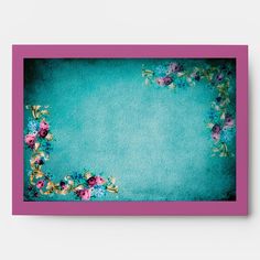 a blue and pink frame with flowers on it