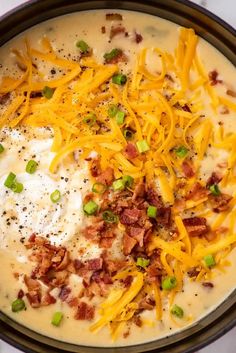 a bowl filled with cheese and bacon soup