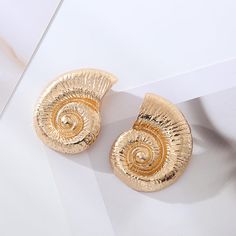 Material: Alloy Color: Gold, Silver Fashion Element: Conch Style: Exaggeration Metal Earrings For Beach In Summer, Summer Beach Metal Earrings, Metal Hoop Earrings For Summer Beach, Summer Beach Metal Hoop Earrings, Gold Shell-shaped Earrings For Party, Chic Gold Earrings For Vacation, Gold Metal Hoop Earrings For Beach, Conch Earrings, Beach Vacation Style