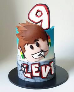 a birthday cake with the number nine on it's face and name is alex