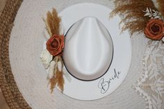 "CURRENTLY ONLY BROWN BAND AVAILABLE  NEW FLOWER COLORS AVAILABLE! 🤍 VEIW OTHER LISTING TO CHANGE HAT COLOR  🤍 Every Bride needs this hat! It's perfect for bridal events including dress shopping, bridal shower, bachelorette, and even your honeymoon! It is boho, fashionable, and unique! 🤍 -adjustable hat -one size fits most people! -breathable, lightweight and comfortable -Material: 65% Cotton, 35% Polyester  -Size:      Hat circumference: 56-58cm/22.22.8\"      Brim width: 7cm/2.75\"     Heig Adjustable Fedora Straw Hat For Wedding, Adjustable Fedora Mini Hats For Wedding, Custom Adjustable Wedding Hats, Adjustable Curved Brim Felt Hat For Wedding, Adjustable Felt Hat With Curved Brim For Wedding, Handmade White Wedding Hat, Bohemian Wedding Hat With Adjustable Fit, Handmade Wedding Hat With Curved Brim, Handmade Curved Brim Hat For Wedding