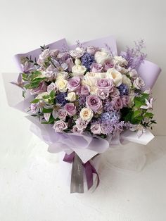 a bouquet of purple and white flowers