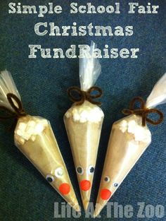 three white plastic cones with brown bows on them and the words christmas fundraiser written above them