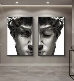 two black and white paintings on the wall in an empty room, one with eyes closed