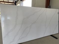 a large white marble slab in a warehouse