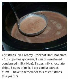 a spoon full of hot chocolate in a crockpot with the recipe below it