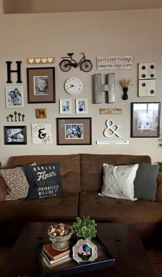 a living room filled with furniture and lots of pictures on the wall above it's coffee table