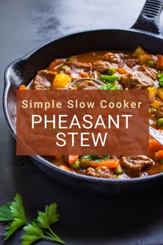 a skillet filled with meat and vegetables on top of a black counter next to parsley