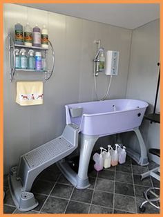 a bathroom with a purple tub and shelves