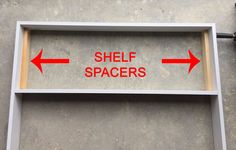 a shelf with two red arrows pointing to the right and left directions on it that says shelf spaces