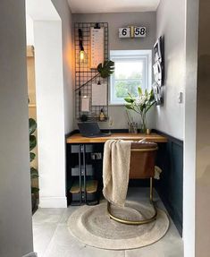 a bathroom with a rug, sink and mirror on the wall next to an open door