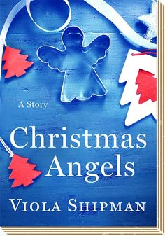 a blue book cover with red and white christmas angel decorations on it's front