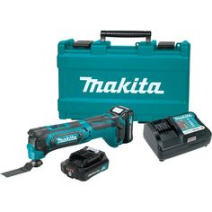 the makita cordless drill is in its case and it's tools are next to it