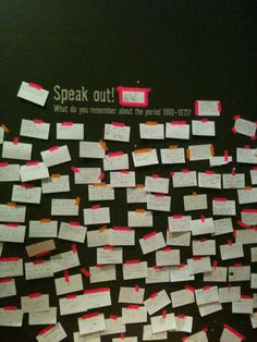 many sticky notes are pinned to the wall