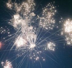 fireworks are lit up in the night sky