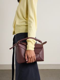 Jonathan Anderson released Loewe's 'Puzzle' bag in 2015 and it remains one of the house's best-selling styles because it still looks so fresh. This updated 'Edge' version has been hand-finished in Spain from textured-leather and has lacquered edges. It can be worn and carried in a few different ways - including as a clutch or over your shoulder.