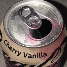 a can of cherry vanilla soda sitting on top of a table