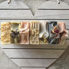 five different soap bars arranged in a heart shape