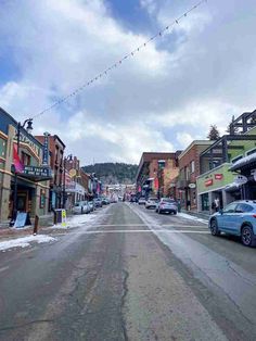 cars are parked on the side of an empty street